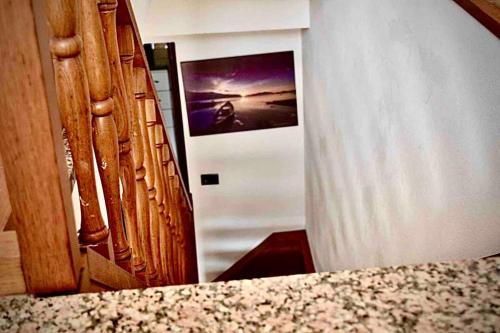 a mirror in a room with a picture on the wall at Sea Trail in Avegno