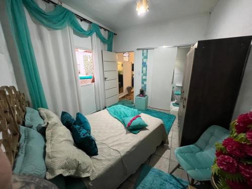 Un ou plusieurs lits dans un hébergement de l'établissement Mansão pé na areia