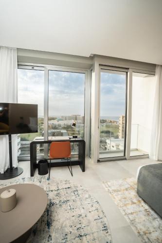 TV a/nebo společenská místnost v ubytování Sama Hotels