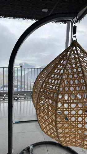 a rattan basket hanging from a railing on a ship at Hotel Maheshwari & Banquet Hall in Tehri-Garhwāl