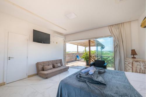 TV a/nebo společenská místnost v ubytování Casa aconchegante com Wi-Fi e piscina prox a praia