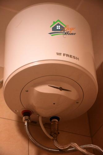 a fire hydrant with the first fresh logo on it at The cozy haven in Kampala