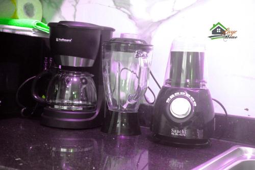 two blenders sitting on a counter next to a blender at The cozy haven in Kampala