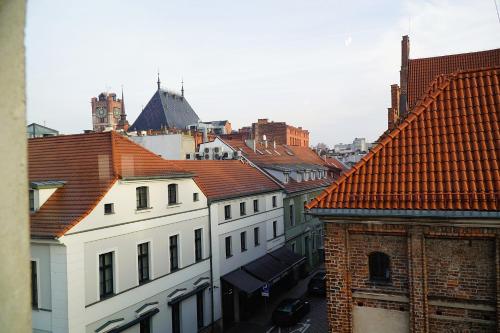 a view of roofs of buildings in a city at Astronomica na Kopernika in Toruń