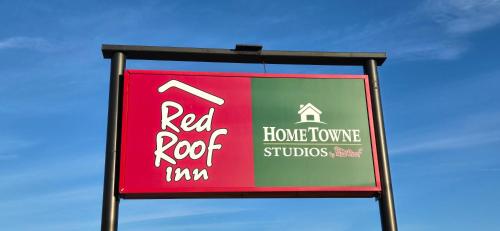 a sign for a red roof studios at HomeTowne Studios by Red Roof LaGrange in LaGrange