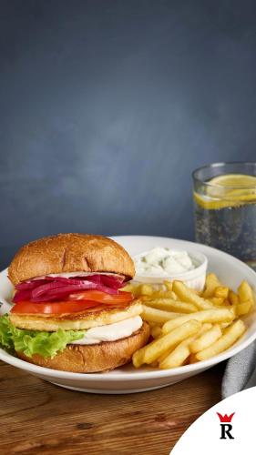 a sandwich and french fries on a white plate at Rasta Arboga in Arboga