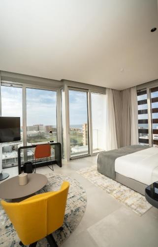 Postel nebo postele na pokoji v ubytování Sama Hotels