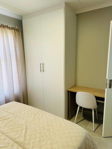 Ένα ή περισσότερα κρεβάτια σε δωμάτιο στο Homely Stay 2