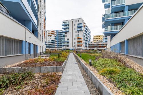 a walkway between two buildings in a city at Marina Bay Apartment with free Parking in Budapest