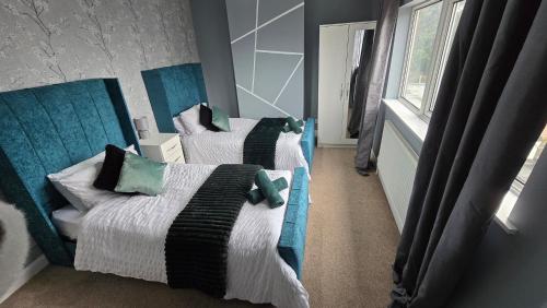 Katil atau katil-katil dalam bilik di Your Home Away from Home in Birmingham
