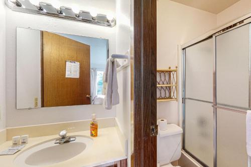 a bathroom with a sink and a toilet and a mirror at Dollar Hill 2 Dreamcatcher in Dollar Point