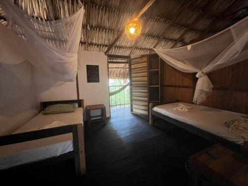 Postel nebo postele na pokoji v ubytování Hostal Zinpar