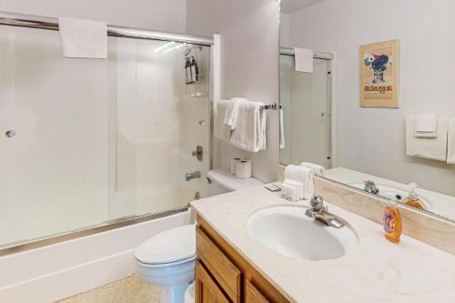 a bathroom with a sink and a toilet and a shower at Tahoe City Retreat in Lake Forest