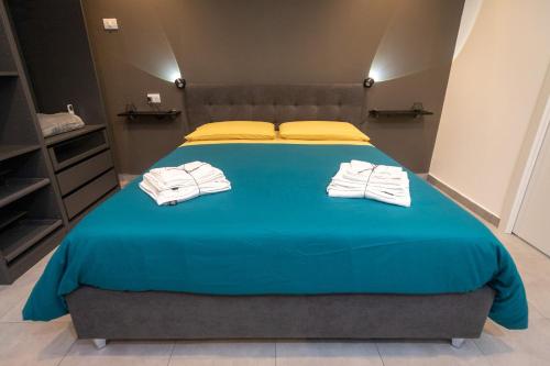Cama o camas de una habitación en The Cliff Appartament Suite