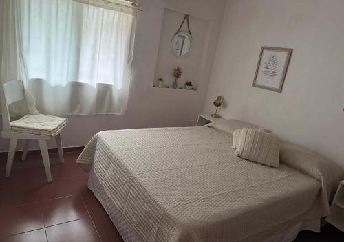 Giường trong phòng chung tại Casa para 4 personas con parrillero