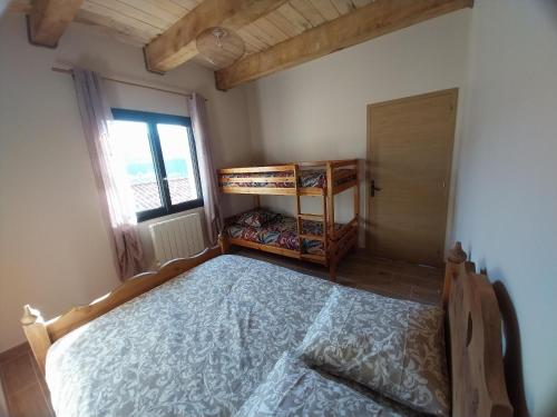 Rúm í herbergi á Gîte Au point de Vue