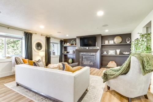 a living room with a white couch and a fireplace at Private Pool and Hot Tub Luxe Unit Near UTA Train! in American Fork