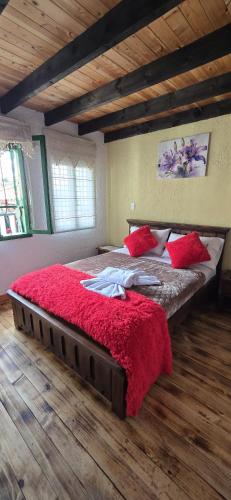Ένα ή περισσότερα κρεβάτια σε δωμάτιο στο Hotel Bugambilia, Pueblito Boyacense