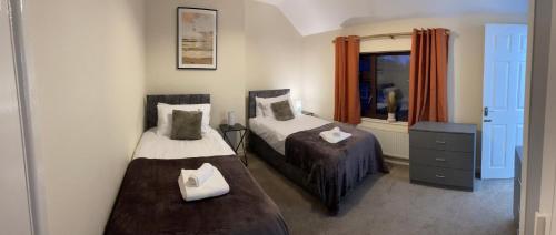 Ένα ή περισσότερα κρεβάτια σε δωμάτιο στο Long Eaton house sleeps 6 & double sofabed