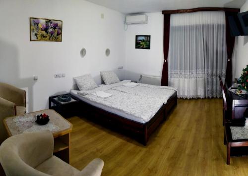 Ένα ή περισσότερα κρεβάτια σε δωμάτιο στο Apartmani "Vila Jelena" Arandjelovac