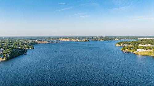an aerial view of a river with houses and trees at Sunset Beach Resort in Osage Beach