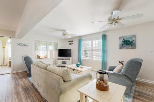 a living room with two couches and a tv at Swann Keys --- 37022 Blue Teal Rd in Selbyville