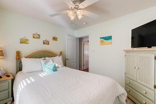 a bedroom with a bed and a ceiling fan at Swann Keys --- 37022 Blue Teal Rd in Selbyville