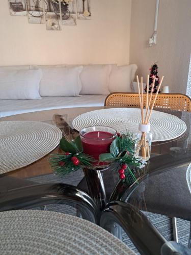 a table with christmas decorations on top of it at Apartman Dream M Zaječar in Zaječar