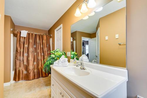 a bathroom with a sink and a large mirror at 2 Mi to Ski Resort Beech Mtn Home with Fire Pit! in Beech Mountain