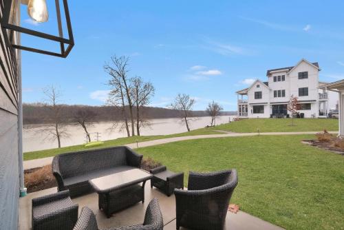 a patio with a table and chairs in front of a house at Out of Office in Ottawa