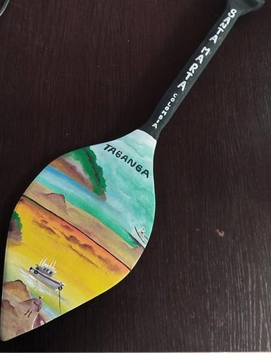a fork with a picture of a beach on it at Hostal Finca San Martín De Loba in Los Naranjos