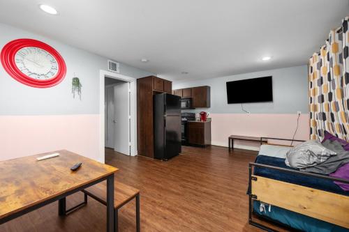 a living room with a couch and a table at Chic & Cozy 1BR Apt with Free Parking & King Bed in Houston