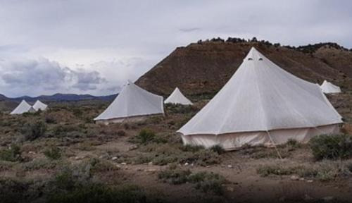 a group of tents in the middle of a field at Bryce Canyon Escalante Glamping in Cannonville