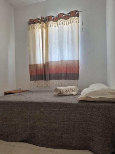 Postel nebo postele na pokoji v ubytování Pousada Aconchego Vitória