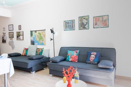 a living room with a couch and a table at PIAZZA LAURINO Apartments in Laurino