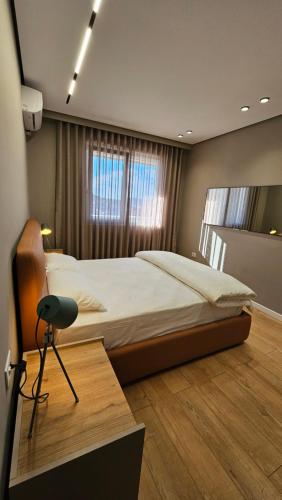 Postel nebo postele na pokoji v ubytování Kris Apartments