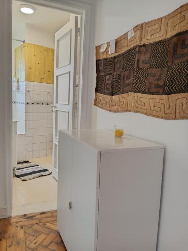 a bathroom with a white cabinet and a shower at Milena 2 in Lisbon