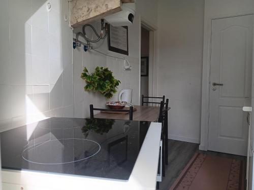a kitchen with a glass counter top in a room at Milena 2 in Lisbon