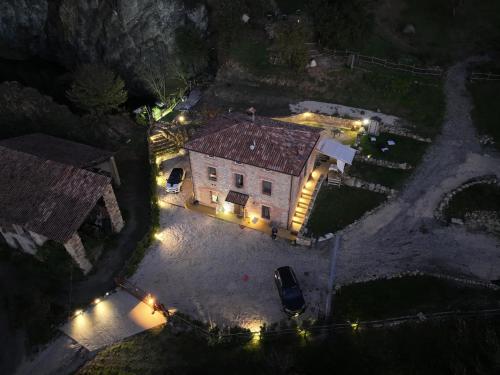an aerial view of a house at night with lights at Sul lago in Salsomaggiore Terme