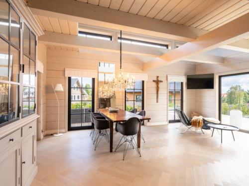 a dining room with a table and chairs at Villa in Abertamy near Klinovec Ski Resort in Abertamy
