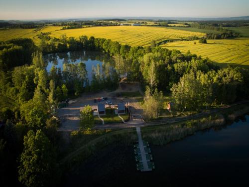 an aerial view of a house next to a river at Villa in Cervene Janovice near Kutna Hora Castle in Červené Janovice
