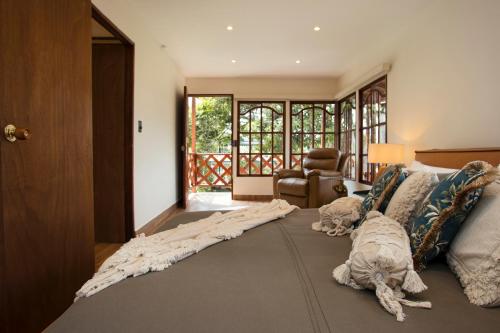 two dogs laying on the floor in a bedroom at GreenOriental Resort in La Vega
