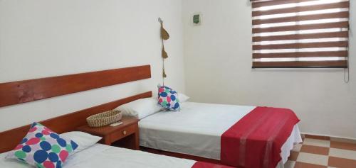 Ένα ή περισσότερα κρεβάτια σε δωμάτιο στο 4 Tiburón Toro Squalo's place