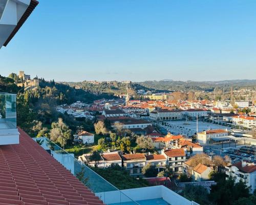 a view of a city from the roof of a building at Vila Pombal Tomar - Luxury Apartment with private pool and Castle View in Tomar