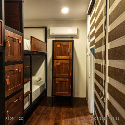 a small room with a bunk bed and a closet at The Cubes Ella in Ella