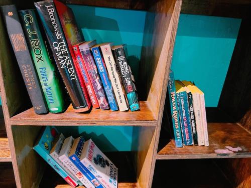 a book shelf filled with lots of books at Pet friendly 2 bedroom located in the heart of OKC in Oklahoma City