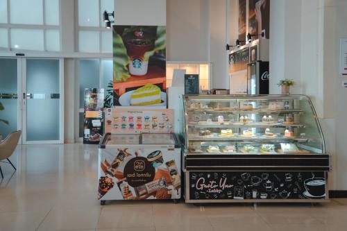 a bakery with a display of pastries in a store at D Varee Jomtien Beach, Pattaya in Jomtien Beach