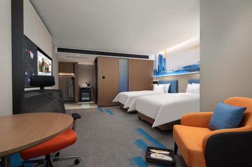 Hampton by Hilton Changsha Wuyi Squareにあるベッド