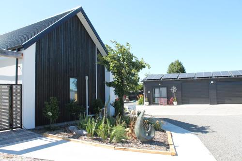 a black and white house with a cactus at Marlborough Wine Country B&B in Blenheim