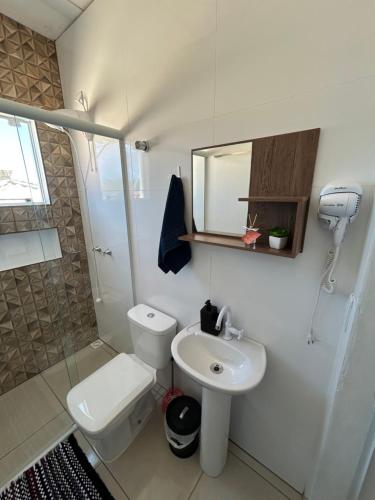 Ένα μπάνιο στο Apartamento Imbituba